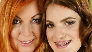 Mature inked babe and her younger lesbian friend