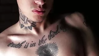 Inked twink teasing while stroking cock passionately solo