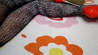 Leopard tights and red high-heeled shoes