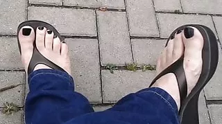 black toenail polish and black platform flip flops