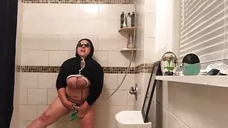 Masturbating with shower head and small broom