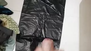 Huge cum on black bags in the bathroom