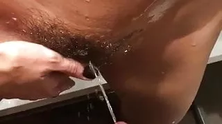 Pissing on hairy pussy