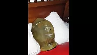 Latex breathplay hood and electro chastity