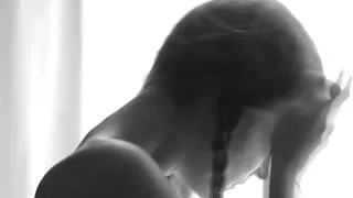 Erotic. Between closed curtains.