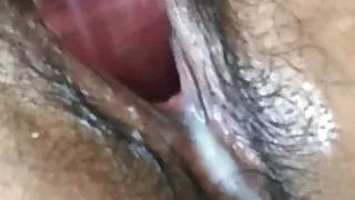 Philippino girl making her hairy pussy very wet