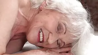Horny granny Norma needs young hard cock on a massage table