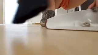 Cute Girl Cleaning in Shorts