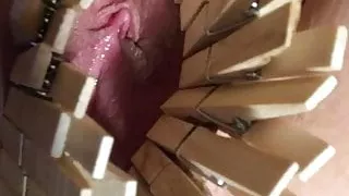 Cloth pins on pussy lips. Ass full of glass.