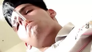 Homosexual thug smokes and plays with a penis pump solo
