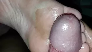 Massive cumshot footjob