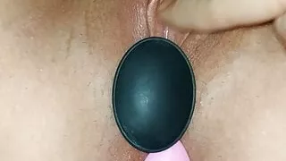 My girlfriend using 2 pluggs, closup , at home