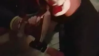 Clown Having Some Feet On His Face
