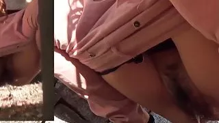 Japanese brunette squats while pissing outdoors