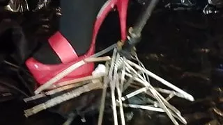 Lady L crush umbrella with sexy red high heels.
