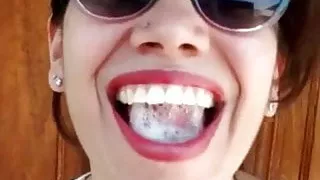 Pretty Girl Plays With A Mouthful Of Cum On The Street