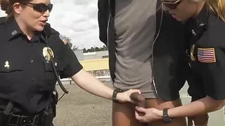 Big ass uniformed babes fuck a criminal on the rooftop