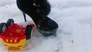 Winter crush: Lady L  crush yellow toy car.