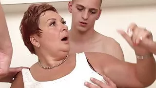 Chubby redhead granny munching on cock while pussy fingered