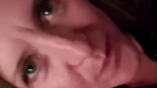 Sucks his partner's dick with her clothes on.