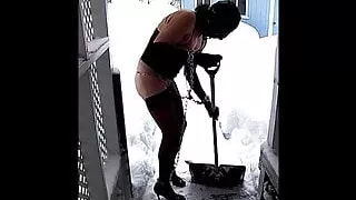 Bondage sissy shovels snow in chains