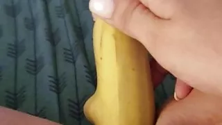 Defiled her cock hole with a banana while her assholes plugg