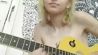 Happy naked babe jamming