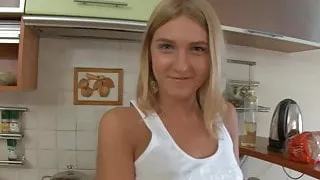 Dirty blonde teen dines on some cock in the kitchen