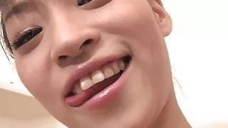 Young Asian cutie masturbates with the shower head