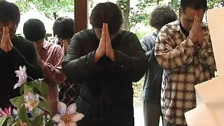 Japanese girl plays with her pussy while some boys peep