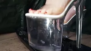 Lady L crush plastic with sexy black extreme high heels .