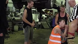Mature man bent over and drilled by car shop workers