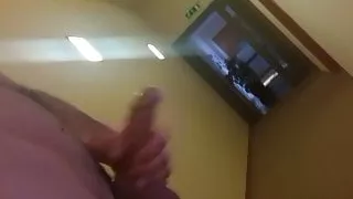Cumming in hotel hallway