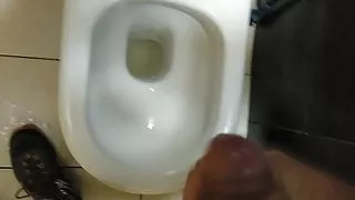 pissing in public bathroom