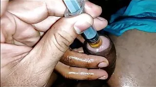 Hubby and wife nude injecting oil in pennis