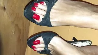 Black Mules and red Toenails