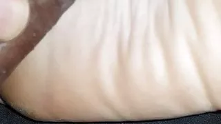 Rubbing cock on wrinkled soles