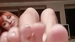 Sexy redhead babe shows her perfect soles and toes
