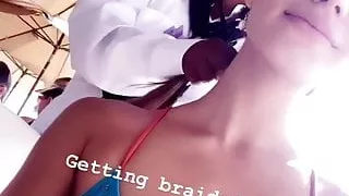 Madison Grace Reed in bikini top, getting her hair braided