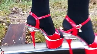 Lady L walking metal road with sexy red high heels!