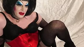 Horny Drag Queen plays with anal beads, licks them clean