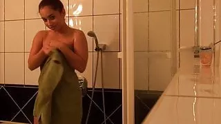 Amazing brunette lets her man record her shower