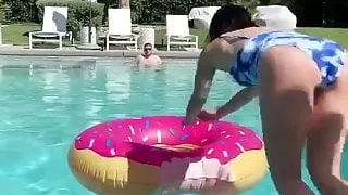 Lucy Hale jumping into a pool