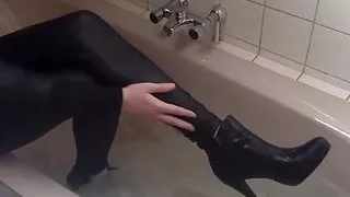 Sexy tight pants ankle boots and heels in bath