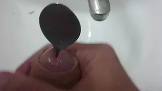 Spoon in the penis, cum