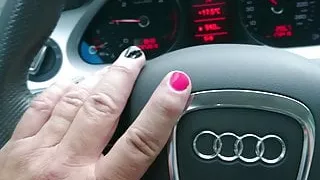 Crossdressed in shiny nylons, dress and heels driving car.