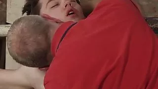 Mature master Sebastian Kane strokes his bound slaves cock