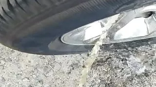 Quick piss on truck tire