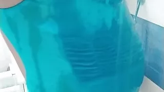 Boy on min one piece swimsuit take a shower