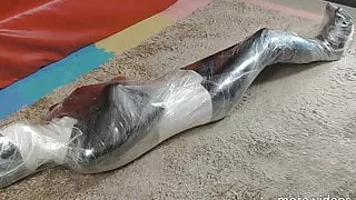 Leather slave plastic wrap mummy